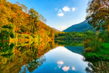 Fototapeta Góry - Autumn colors in the wood and lake