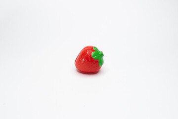 plastic strawberry on white