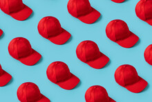 Knolling Red Hats Directly Lined Up On Blue Background From Above