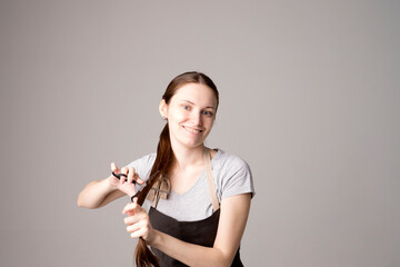 Closeup of a young female hairdresser