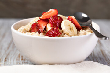 Wall Mural - prepared oatmeal with fruits and berries