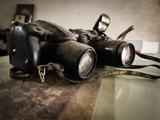 Two retro film cameras on glass table