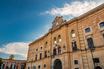 Matera, Basilicata, Italy - Palazzo dell'Annunziata, an eighteenth-century palace located in Piazza Vittorio Veneto.The blue sky on a summer evening.