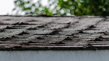 Close-up Of Curled Roofing Shingles