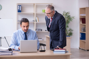 Two employees in the office