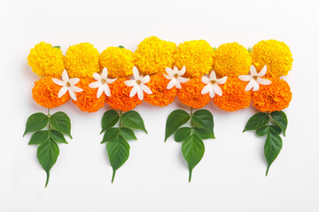 Poster - Flower Rangoli for Diwali Festival made using Marigold and leaf and Oil Lamp over white background,