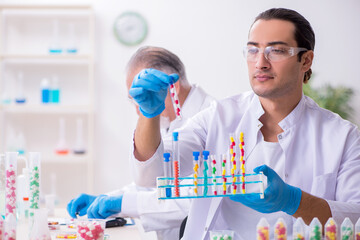 Two chemists working in the lab