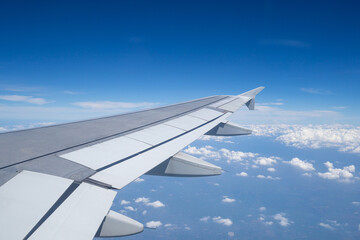 Aerial view of cloudscape seen through airplane window