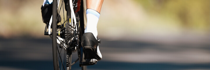 Wall Mural - Racing- bike detail on gear wheels and feet