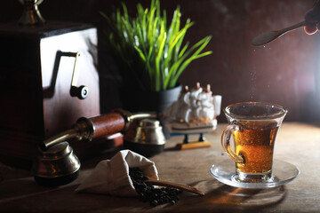 Wall Mural - Brewing tea on a wooden table