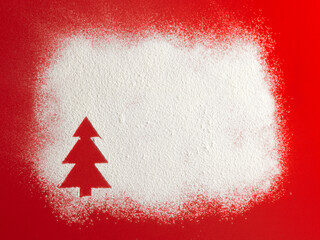 Wall Mural - Christmas tree on flour background. White flour looks like snow. Top view