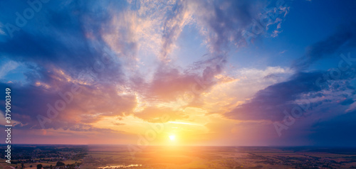 Fotomural Spring rural landscape in the evening with a beautiful burning sky, aerial view
