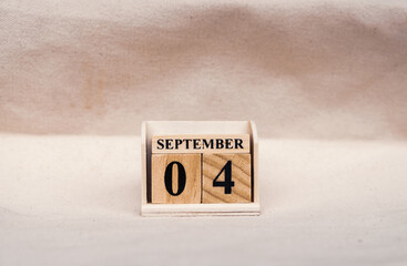 September 4th. Image of September 4 wooden color calendar on white canvas background. empty space for te