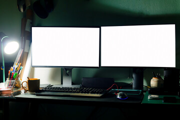 2 computer monitors on the desk at night,Personal Computer with Mobile Application Design Showing on the Monitor Stands on the Office Desk, In the Background People Work on a Blackboard Wall in the Cr