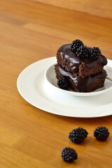 Poster - Chocolate zucchini cake with chocolate ganash and fresh blackberries, vertical 