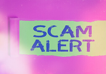 Poster - Conceptual hand writing showing Scam Alert. Concept meaning unsolicited email that claims the prospect of a bargain Rolled ripped torn cardboard above a wooden classic table