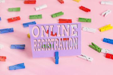 Fototapete - Handwriting text writing Online Registration. Conceptual photo System for subscribing or registering via the Internet Colored clothespin papers empty reminder pink floor background office pin