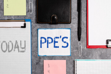 Poster - Word writing text Ppe s is. Business photo showcasing Specialized equipment for protection against health and safety hazard Paper accesories with digital smartphone arranged on different background