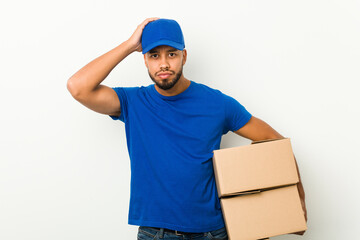 Young south-asian delivery man being shocked, she has remembered important meeting.