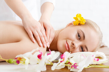 Wall Mural - Relaxing in spa. Smiling woman on massage table