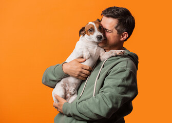 Wall Mural - Happy smiling guy with a dog