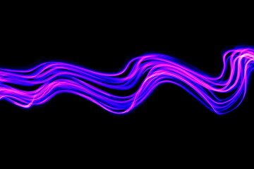 Wall Mural - Long exposure photograph of purple neon colour in an abstract swirl, parallel lines pattern against a black background. Light painting photography.
