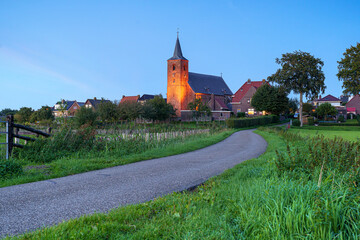 Canvas Print - Medieval church in a beautiful rural landscape