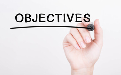 Poster - hand writing objectives with black marker on transparent wipe board