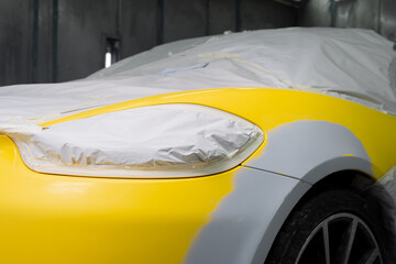 Wall Mural - Auto body repair series: Yellow sports car being repaint