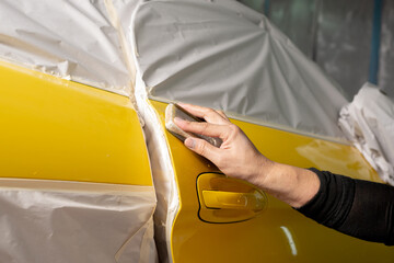 Wall Mural - Auto body repair series: Sanding yellow sports car door