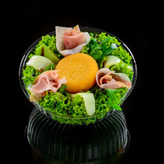 Wall Mural - Tasty mixed salad dish with grilled camembert cheese, prosciutto ham and organic