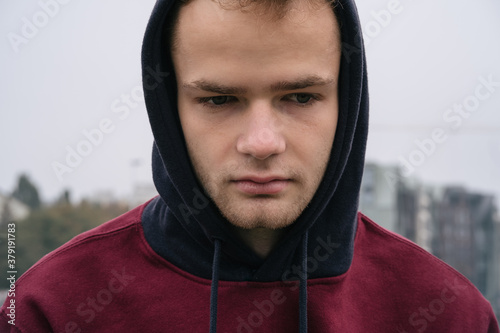 Fotografía portrait of sad pensive unshaven young boy / teenager