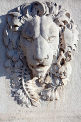 Bas relief of lion .  Animal sculpture carved into a wall 