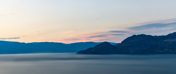 Wall Mural - cloudy sky seen from the shore of Okanagan lake at night British Columbia Canada