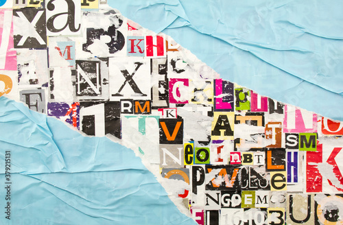 Fotomural Torn, ripped and crumpled blue paper on colorful abstract collage from clippings with letters and numbers background