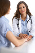 © rogerphoto - Doctor reassuring her female patient. Medical ethics and trust concept. Medicine and health care theme