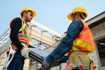 Poster - Ceramic Roof Tiles Installation by Roofer worker,Concept of residential building under construction.