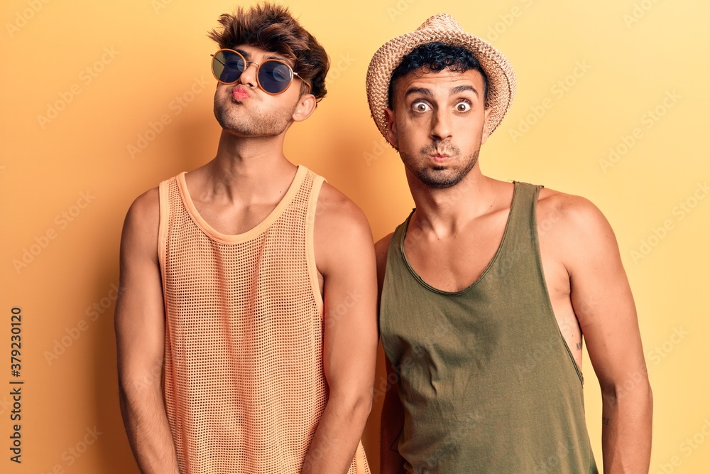 young-gay-couple-wearing-summer-clothes-puffing-cheeks-with-funny-face