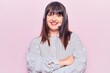 © Krakenimages.com - Young plus size woman wearing call center agent headset happy face smiling with crossed arms looking at the camera. positive person.