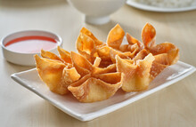 Chinese Crab Rangoon Fried Wontons On Plate With Red Sauce
