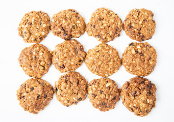 Homemade tasty oatmeal cookies with raisins, dried cranberry and Himalayan mango seeds. Healthy snack concept. Sweet dessert. Close up image.