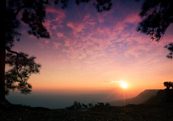 Wall Mural - Mountain and sky sunset background. Mak Duk cliff, Phu Kradueng National Park, Loei, Thailand