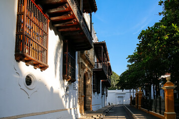 Wall Mural - Side view to historic buildings in the Palace of Inquisition with artful woodwork and white facades,  Cartagena, Unesco World Heritage

