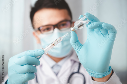 vaccines fight against virus covid-19 corona virus, doctor or scientist in laboratory holding a syringe with liquid vaccines for children or older adults,Concept:diseases,medical care,science.