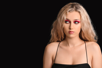 Poster - Young woman with beautiful eyeshadows on dark background