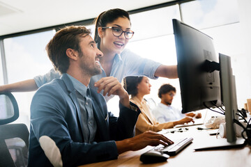 Happy business people having fun and chatting at workplace office