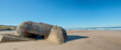 ruins of german bunker in the beach of Normandy, France