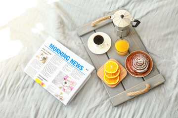 Wall Mural - Tray with tasty breakfast and newspaper on bed