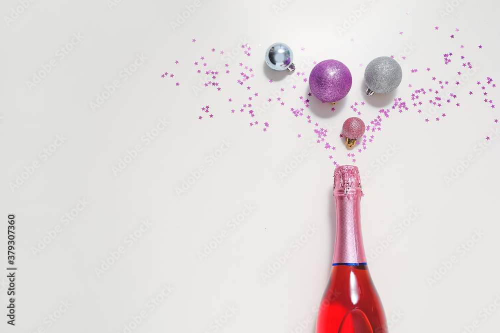 Christmas composition with bottle of champagne on white background