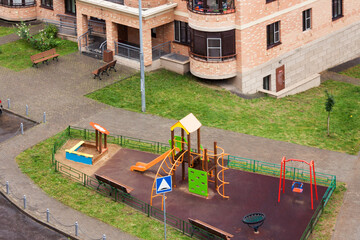 Wall Mural - Aerial view children playground in new residential area complex. Urban development common area housing concept